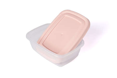 Open plastic food storage container with pink lid isolated on white background. Food box for lunch. Close upの写真素材