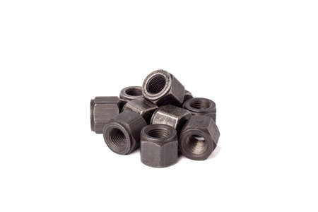 bunch of metallic nuts isolated on white background. Heavy hex nut. Female screw nut with copy space. Fastenerの写真素材