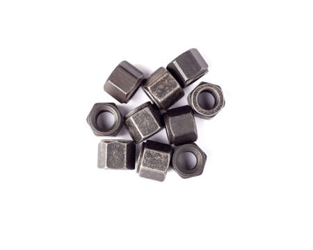 bunch of metallic nuts isolated on white background. Heavy hex nut. Female screw nut with copy space. Fastener top viewの写真素材