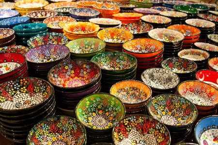 Colorful ceramic plates for sale in Turkey. Decorated tableware in the tourist store. souvenir shopの写真素材