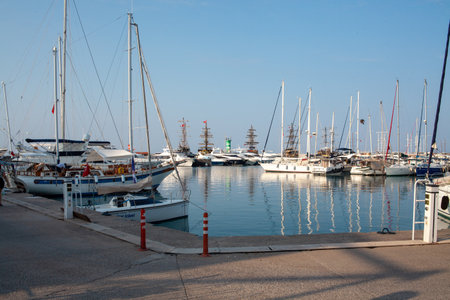 Many yachts and boats in the harbor. Ships on pier in port. Kemer, Turkey - 07/08/2020のeditorial素材