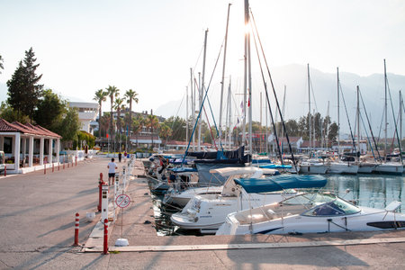 Many yachts and boats in the harbor. Ships on pier in port. Kemer, Turkey - 07/08/2020のeditorial素材
