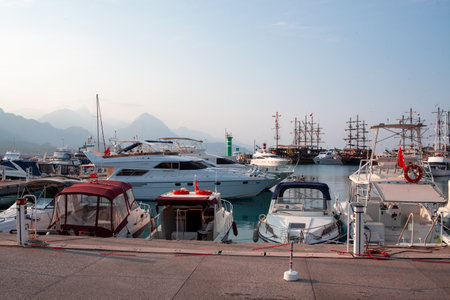 Many yachts and boats in the harbor. Ships on pier in port. Kemer, Turkey - 07/08/2020のeditorial素材