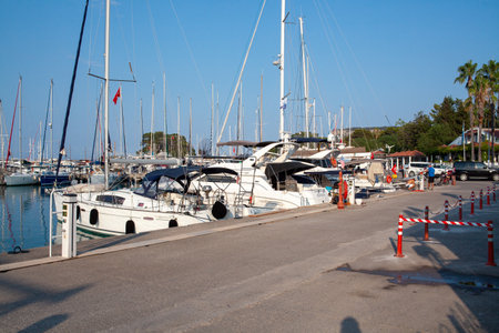 Many yachts and boats in the harbor. Ships on pier in port. Kemer, Turkey - 07/08/2020のeditorial素材