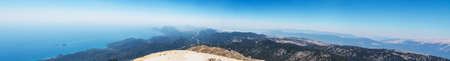 Panoramic view from Tahtali mountain on sea coast and mountain valley in Turkey. Panorama of sea landscape. Green forest and rocks from top.の写真素材