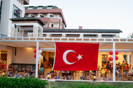 Kemer, Turkey - 07/11/2020. Turkish flags in hotel restaurant. Hotel event Turkish night show with National food, music and entertainment for tourist guests.のeditorial素材