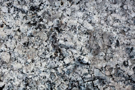 Ashes texture bacground. Wood ash in fireplace. Defocused charcoal cinder textured. Close upの写真素材