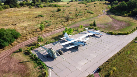 Old soviet aircraft and helicopter parked on exhibition area in open air museum. Drone view photo. Marshal Konev Height Memorial near Kharkov, Ukraine. Kharkov, Ukraine - August 23. 2021のeditorial素材