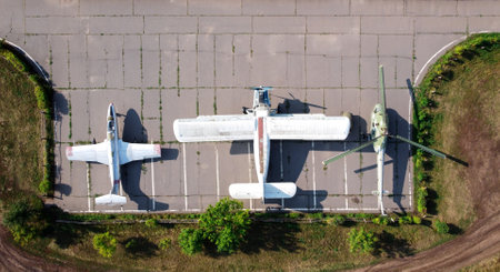 Old soviet aircraft and helicopter parked on exhibition area in open air museum. Abandoned military aircrafts. Drone view photo. Kharkov, Ukraine - August 23. 2021のeditorial素材