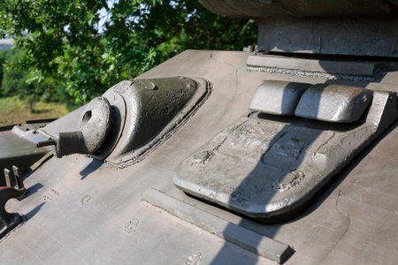 Close up of machine gun and metal hatch on soviet tank from Second World War II. Selective focus on...
