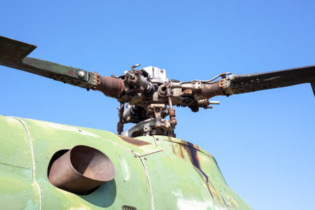 Detail of engine cover housing and rotors of an old military helicopter against blue sky. Kharkiv, Ukraine - August 23. 2021のeditorial素材