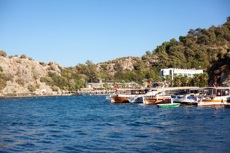 Harbor and port in resort village with moored touristic boats and ships. Marina in Turunc. Boat taxi to move tourists between sea villages. Turunc, Turkey - September 4. 2021のeditorial素材