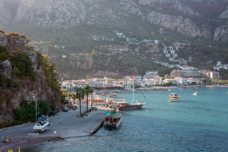 Sea bay surrounded by mountains and rocks in small touristic village Turunc. Landscape with moored pleasure yacht. Turunc, Turkey - September 4. 2021のeditorial素材