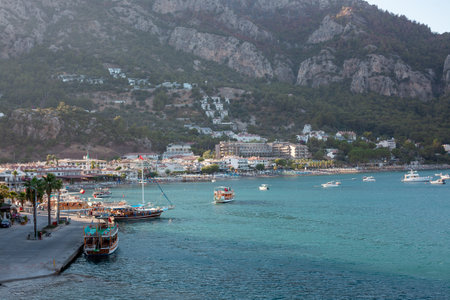Sea bay surrounded by mountains and rocks in small touristic village Turunc. Landscape with moored pleasure yacht. Turunc, Turkey - September 4. 2021のeditorial素材