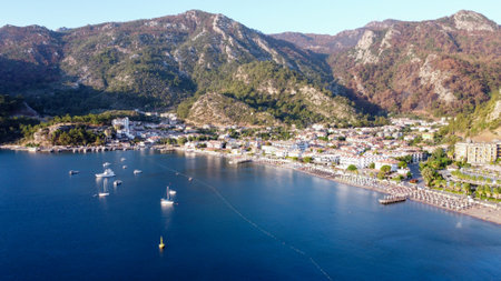 Seascape drone view. Sea bay surrounded by mountains and rocks in small touristic village Turunc. Landscape with moored pleasure yacht. Turunc, Turkey - September 11. 2021のeditorial素材