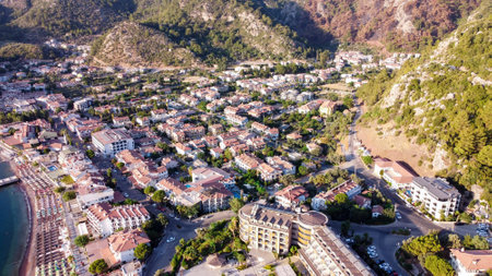 Aerial drone view of Turunch village. Small resort village on the shores of the mediterranean sea with many small boats in a bay. Turunc, Turkey - September 6, 2022のeditorial素材