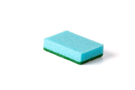 A kitchen sponge isolated against white background. Blue Dish washing sponge.の写真素材