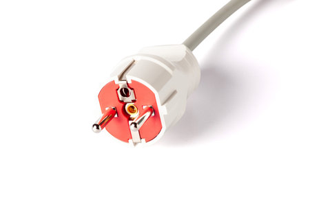 Electric plug with outlet isolated on white background. European electric plug assembly.