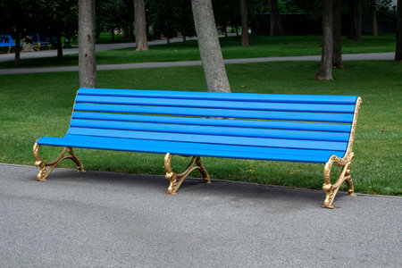 blue Wooden bench in the city park.の写真素材