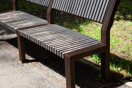 Wooden bench in the city park.の写真素材