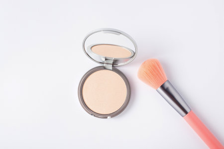 Beautiful eyeshadow palette with makeup brush lie on the table top view. makeup product.の写真素材