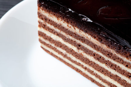 Close-up of a layered chocolate and cream cake, a tempting dessert with rich flavors and textures.