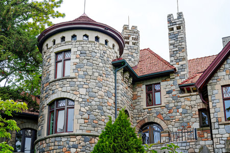 Charming stone castle with towers and arched windows, highlighting historical architecture and elegance. Generative AIの素材