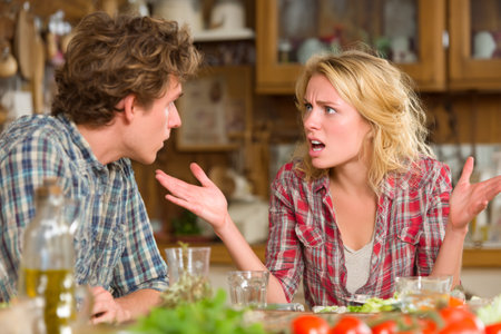 A man and woman engage in a heated argument at the kitchen table filled with food. Their expressions show frustration and intensity in the evening atmosphere.の素材