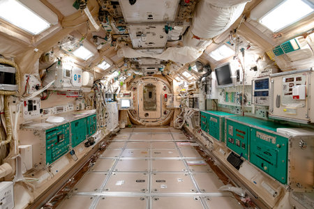 Inside a space station module, a gravity experiment is underway. Scientists monitor equipment while observing the effects of microgravity on various materials.の素材