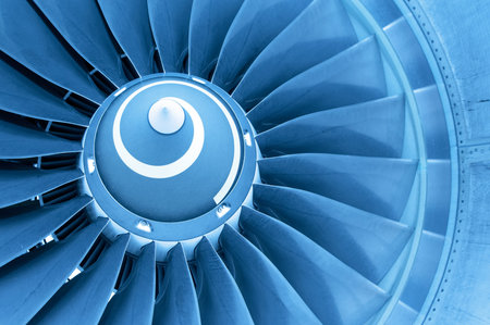 Titan blades of jet plane engine in blue light