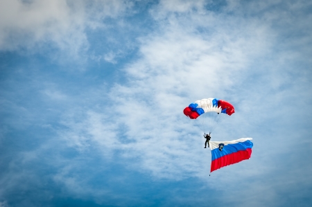 Skydiver with Slovenian flag, parachute in colors of Slovenian flagの写真素材
