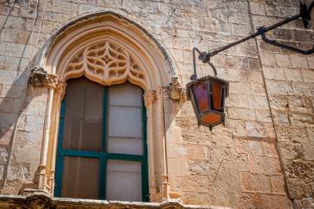 Medivial architectured window with old light in Mdina, Maltaの写真素材