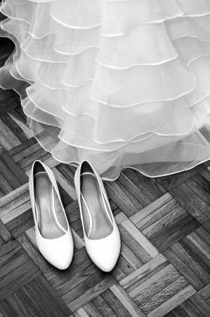 Wedding shoes and dress, black and whiteの写真素材