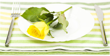 Fresh yellow rose, fork and flower. Healthy food conceptの写真素材