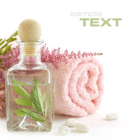 Jar with fresh leaves and towel (SPA concept) (With sample text)の写真素材
