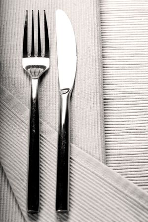 Vintage knife and fork on linen napkin sepia tonedの写真素材