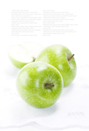 Fresh Green apples on white napkinの写真素材