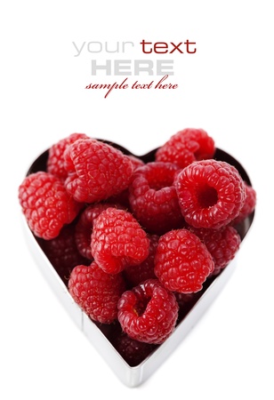 fresh raspberries in a heart shape representing love and valentines day images (easy removable text)の写真素材