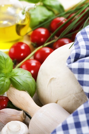 ingredients for homemade pizza(dough, cheese, olive oil and vegetables) の写真素材