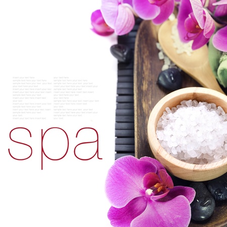 spa concept (zen stones, sea salt, towel and orchid) over white with sample textの写真素材
