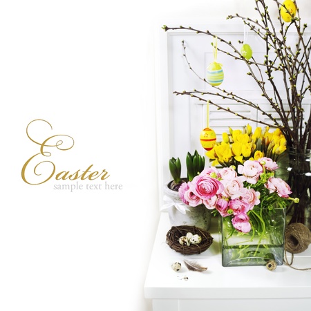 easter composition with eggs and spring flowers on white background (with sample text)の写真素材
