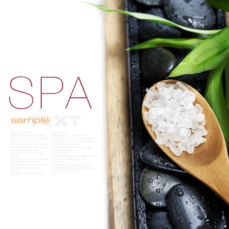 spa concept (zen stones, sea salt and bamboo) on wooden board - with sample textの写真素材