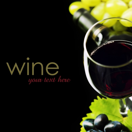 Glass of  wine and grape on black background  (easy removable sample text)の写真素材
