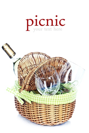 picnic basket with a bottle of wine and glasses over white (easy removable sample text)の写真素材