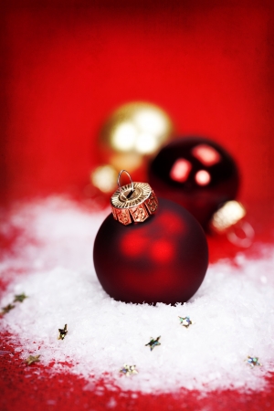 Red Christmas balls on red backgroundの写真素材