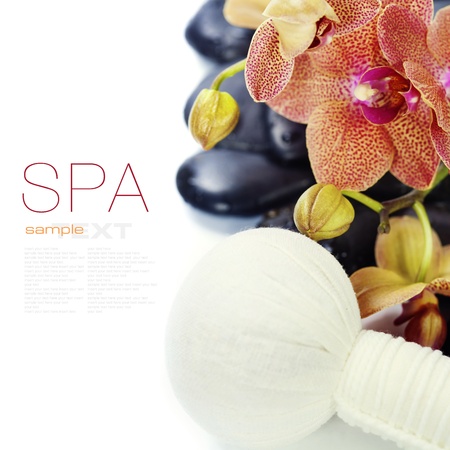 spa concept (zen stones, Herbal massage balls, orchid flower) over white  (with easy removable sample text)の写真素材