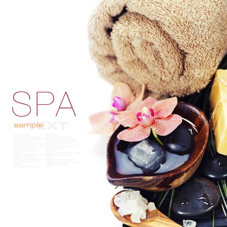 spa concept (zen stones, sea salt, soap, orchid flower and towel) over white  (with easy removable sample text)の写真素材