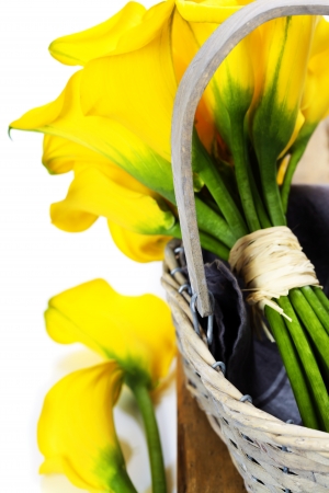 Beautiful calla lilies bouquet in a basketの写真素材