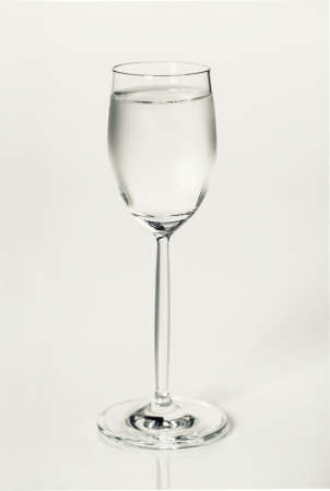 Glass of vodka isolated on whiteの写真素材