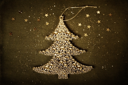 Metal christmas tree on fabric background の写真素材